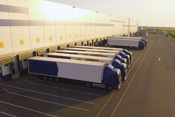 trucks parked on a warehouse