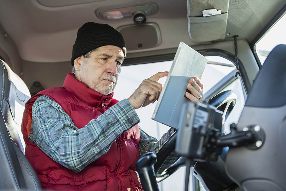truck driver with a tablet